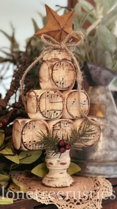 a christmas tree made out of wine corks with music notes on it and an ornament hanging from the top