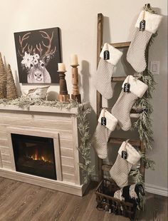 stockings hung on a ladder next to a fireplace