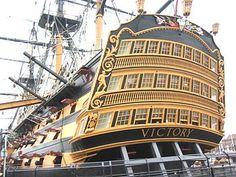 a large yellow and black boat with lots of windows