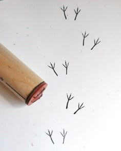 a rubber stamp that has been placed on a piece of paper with trees drawn on it