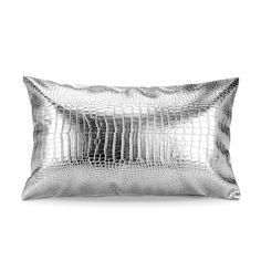 a silver pillow on a white background with an image of a snake skin pattern in the middle