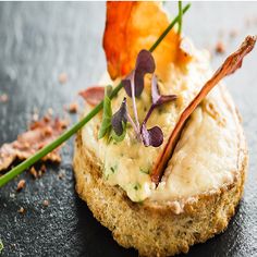 a piece of bread topped with vegetables and garnish