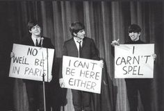 three young men holding up signs in front of a microphone with the words buns, buns, and nun written on them