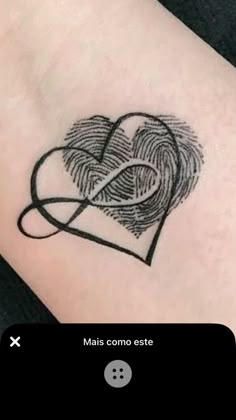 a heart with a fingerprint tattoo on it