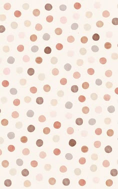 a white background with lots of brown and pink polka dotes on it's surface