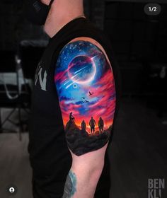 a man with a tattoo on his arm that has an image of two people in the sky