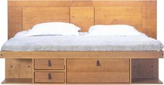 the bed is made up and has drawers underneath it, with two pillows on top