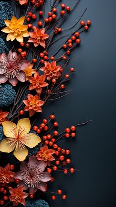 an arrangement of flowers and berries on a black background