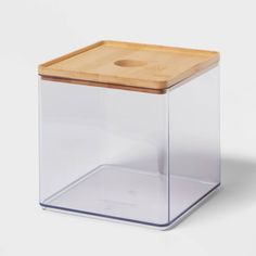 a clear box with a wooden lid on the side and a square cutout in the middle