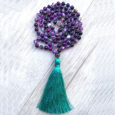 This Handmade Traditional 108 Bead Mala Features Purple Agate Beads Which Are Knotted Between Each With Kelly Green Knotting Thread. It Is Finished Off With A Kelly Green Tassel And Guru Bead. Mala Beads Are Used To Set Intentions, Meditation Or Count Your Breath While Meditating, And Reciting Mantras. Purple Agate Is A Third Eye Chakra Stone. Mala Necklaces Can Also Be Worn For Style And Positive Energy. 8mm Natural Stone Beads This Necklace Is 42 Inches The Tassel Is About 4 Inches Purple Beaded Necklace, Collar Rosa, Third Eye Chakra Stones, Purple Bead Necklace, Fashion Purple, Set Intentions, Mala Bead Necklace, Knotted Necklace, Purple Beaded