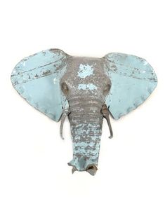 an elephant's head is painted blue and silver