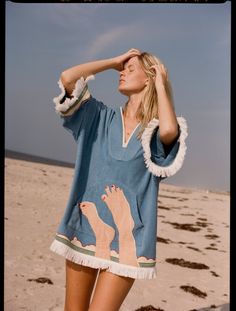 Fringed hems. Custom Tom Wesselmann x Tombolo interior label. Appliquéd feet and ocean from Tom Wesselmann's Seascape #6. Made from plush, double-faced terry cloth (90% organic cotton / 10% recycled polyester at 320 gsm), this poncho doubles as a towel after a swim. Beach Towel Dress, Tom Wesselmann, Sea Clouds, Beach Poncho, Ocean Hues, Beach Shawl, Coverup Dress, Upcycle Sewing, Hand Chain