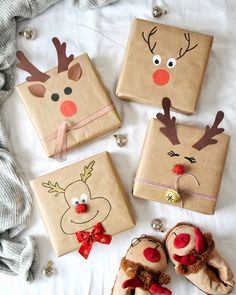 christmas presents wrapped in brown paper with reindeer faces on them