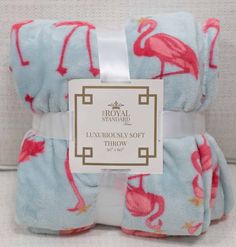 three towels with flamingos on them sitting next to each other