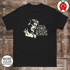 Embrace the strength of your Christian faith with our "Power in the Name of Jesus" shirt. This powerful design highlights the immense spiritual strength that comes from Jesus Christ. By wearing this shirt, you express your unwavering belief in the transformative power of His name. Let your faith shine and inspire others with this meaningful and stylish shirt. The 100% cotton men's classic tee will help you land a more structured look. It sits nicely, maintains sharp lines around the edges, and goes perfectly with layered streetwear outfits. Plus, it's extra trendy now!   * 100% cotton  * Sport Grey is 90% cotton, 10% polyester  * Ash Grey is 99% cotton, 1% polyester  * Heather colors are 50% cotton, 50% polyester  * Fabric weight: 5.0-5.3 oz/yd² (170-180 g/m²)   * Open-end yarn  * Tubular Church Volunteers, In The Name Of Jesus, Spiritual Strength, Sunday School Teacher, Ash Wednesday, Worship Leader, All Saints Day, Baby Dedication, Jesus Shirt