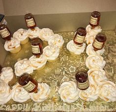 some cupcakes with whipped cream and jam on them