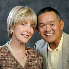 an older man and woman smiling for the camera with their heads turned to look like they are in love