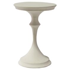 a white pedestal table on a white background