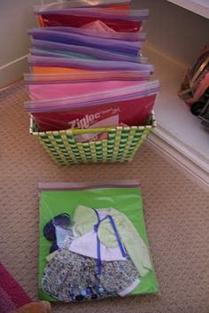 a pile of papers sitting on the floor next to a bag