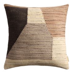 a brown, beige and black pillow on a white background