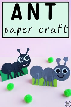 an ant paper craft with green pom poms