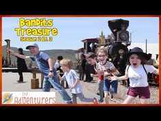 a group of children are dancing in front of a train