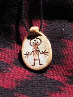 The Big Hands on this design motif seem to emphasize the power of this human Horned figure.  He was found up in the Capital Reef area of Utah and is from the Fremont culture Indian tribe.  Our pendants are made of highfired stoneware clay with a  impressed design that is stained and then fired on.  The pendant hangs on a 2mm black waxed cotton cord that can be adjusted for length. Our designs are inspired by ancient art found throughout the world. Many of the designs are depictions of petroglyph Man In The Maze, Big Hands, Indian Tribes, Basket Design, Art Pendant, Pottery Designs, Ancient Cultures, Stoneware Clay, Cotton Cord