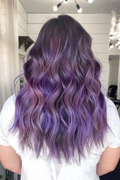 Woman with dark brown hair featuring vibrant purple balayage highlights. Purple Highlights Brown Hair, Purple Brown Hair, Purple Hair Highlights, Purple Highlights