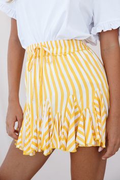 Twirl the day away in this adorable skirt featuring an elasticated waist with drawstring, prettiest stripe print fabric and flounce-frill inserts around the hem. Perfect for your Spring/Summer wardrobe. Pair it with a cool white tee or tank top. Dress it up with some tan wedges or go casual with some crisp white sneakers for a look we are loving. Preppy Teen, Greenhouse Academy, Tulle Mini Skirt, Instagram Clothes, Ruffle Skirts, Striped Mini Skirt, Short Pollera, Chic Summer Style, Winter Shorts