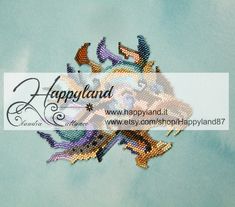 a cross stitch pattern with the words happyland on it and an image of a fish