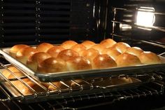 bread rolls in an oven cooling on the rack and baking them into the oven,