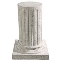 a white stone pillar with two columns on each side and one column at the top