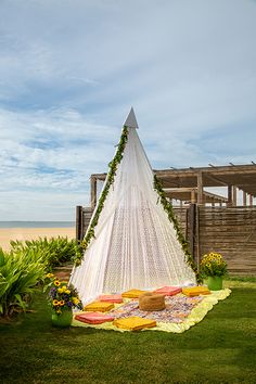 a hammock set up in the grass with flowers