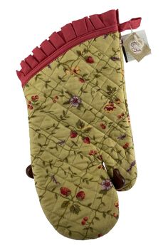 a oven mitt with flowers on it and a tag hanging from the top of it