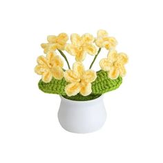 crocheted yellow flowers in a white vase