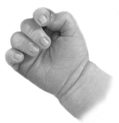 a black and white photo of a hand holding something