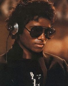 a young man wearing sunglasses and headphones