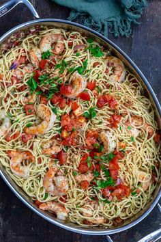 pasta with shrimp and tomatoes in a pan