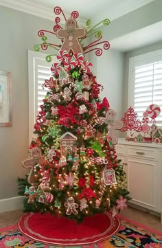 a christmas tree decorated with gingerbreads and candy canes