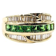 Channel Set .54ctw Tsavorite Garnets & .75ctw diamonds Ring In Yellow Gold This striking Gemstone Fashion Ring, artfully crafted in 14kt Yellow gold, boasts a vibrant .54ctw Tsavorite Garnets centerpiece, beautifully complemented by .75ctw baguette diamonds set in a sleek channel. These diamonds are of SI clarity, exhibiting a near-colorless white hue that enhances the ring's allure. The harmonious blend of the vivid green tsavorite garnets with the sparkling diamonds makes this piece truly capt Tsavorite Jewelry, Branded Jewellery, Gold For Sale, Channel Setting, Tsavorite Garnet, Baguette Diamonds, Hand Ring, Diamonds Ring, Green Hues