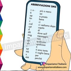 a person holding up a smart phone with spanish words on it