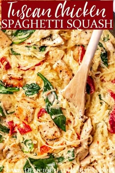 chicken spaghetti with spinach and red peppers in a skillet