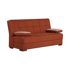 an orange couch with two pillows on it