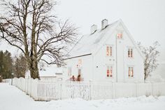 a white house in the middle of winter