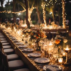 a long table is set with candles, plates and vases for an elegant dinner