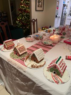 a table topped with lots of different types of cakes and desserts on top of plates