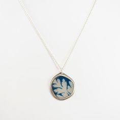 A Cyanotype photograph of a leaf are encased in a sterling silver frame and jeweler's resin, with sterling silver ear hooks. Jen's jewelry is limited edition and one-of-a-kind art jewelry made with her own or collected photography, fine metals, and resin. Says Jen, "I created my first collection of Photo-Jewelry nearly 20 years ago. This idea came to me as a direct result of my art school education at Pratt Institute, where I majored in photography and my work experience as a studio assistant. M Cyanotype Ideas, Ear Hook, Leaf Necklace, Work Experience, Silver Frame, Resin Jewelry, Photo Jewelry, Jewelry Art, Fashion Accessories