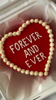 a heart - shaped cake with the words forever and ever written in white frosting