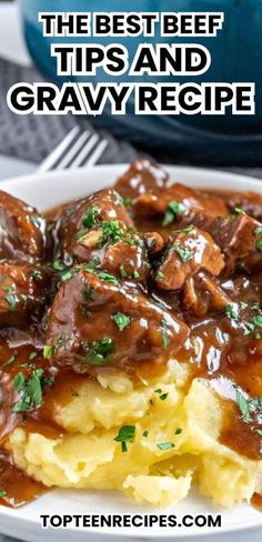 the best beef tips and gravy recipe on a white plate with mashed potatoes