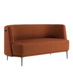 an orange couch sitting on top of a white floor next to a wooden frame and metal legs